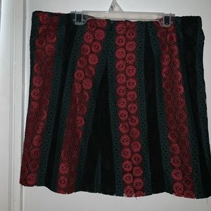 Green , red , and black skirt